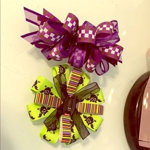 Two hair clips one purple other Halloween theme